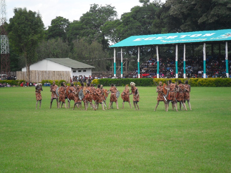 Tribal dancers performing in front of the packed stadium
