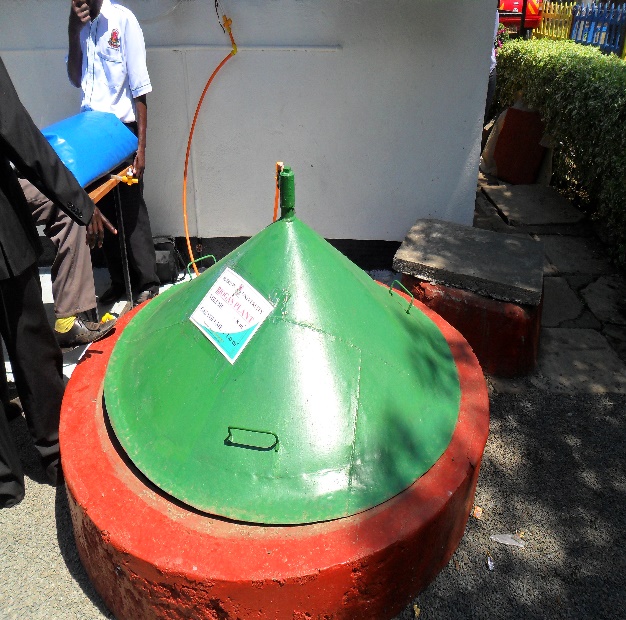 Demonstration of a biogas plant at the Egerton University stall.